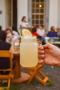 Close-up of people in glass on table