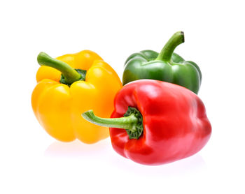 Close-up of bell peppers against white background