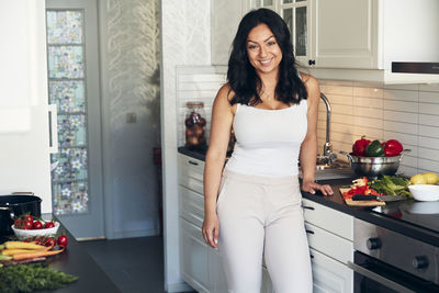 Smiling woman in kitchen