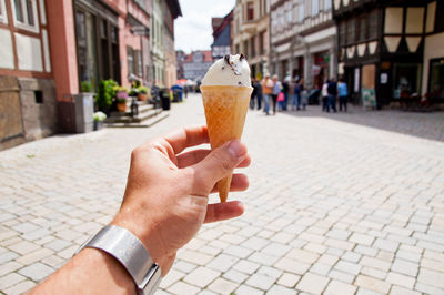 Midsection of woman holding ice cream