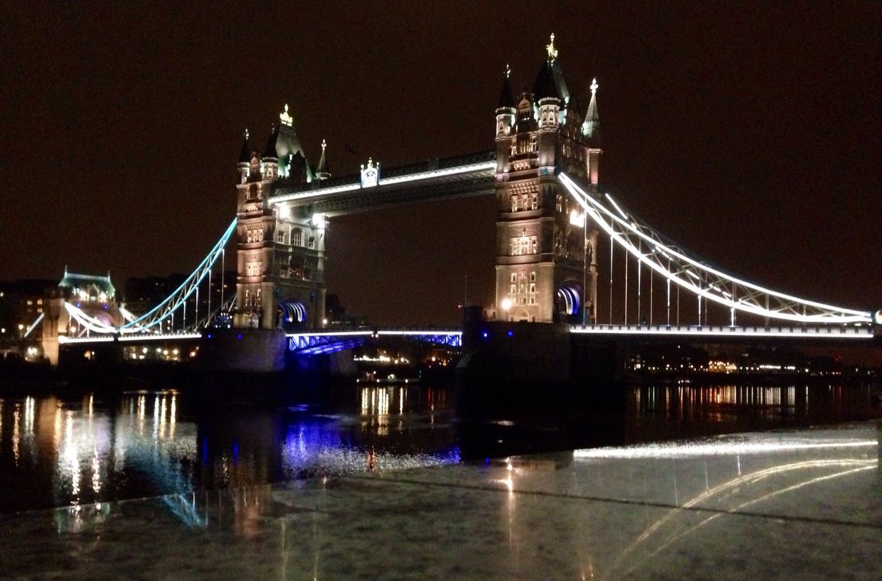 architecture, built structure, illuminated, night, connection, bridge - man made structure, famous place, engineering, river, international landmark, travel destinations, building exterior, water, capital cities, bridge, waterfront, tourism, city, suspension bridge, travel