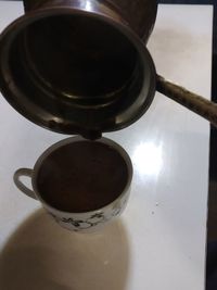 High angle view of coffee cup on table