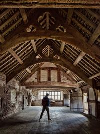 Full length of man walking in building