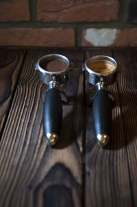 Photo of coffee, pre and post grinded on wooden table