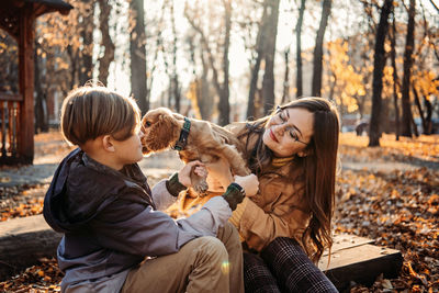 Side view of mother and daughter at park