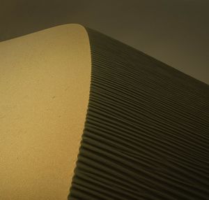 Close-up of paper on sand