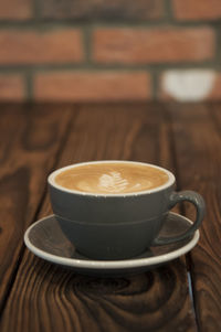 Close-up of cappuccino on table