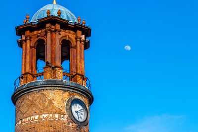 Low angle view of building against blue sky