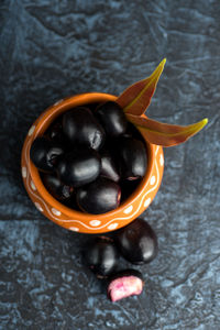 High angle view of black fruit on table