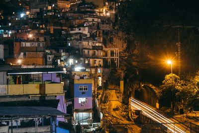 High angle view of illuminated houses at night