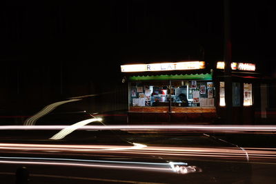 Light trails on street in city at night