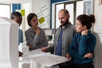 Business colleagues working in office