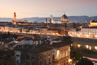 High angle view of illuminated buildings in city