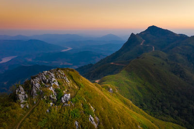 Scenic view of mountains against sky during sunset