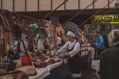 Group of people at market stall