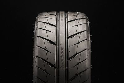 Close-up of tire against black background