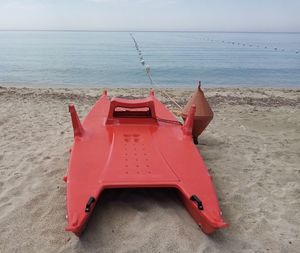 Lifeguard hut on beach against sky