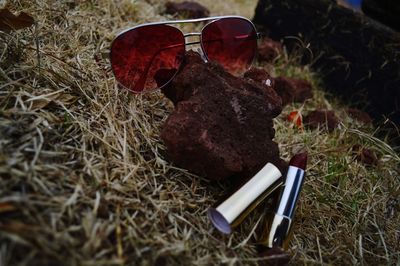 Close-up of sunglasses on grass