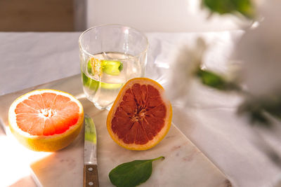 Close-up of orange juice on table