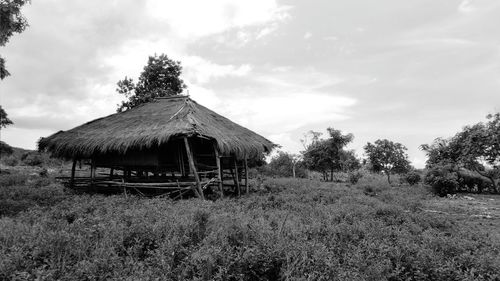 Built structure on field against sky