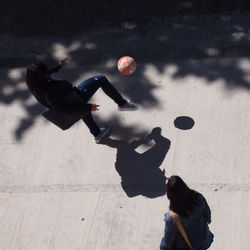 Point of view of woman kicking ball
