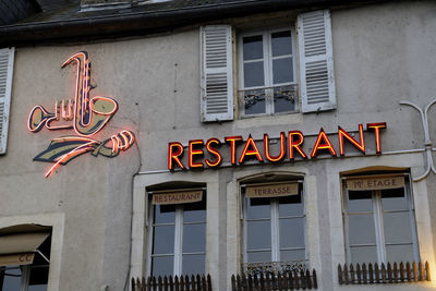 Low angle view of text on building