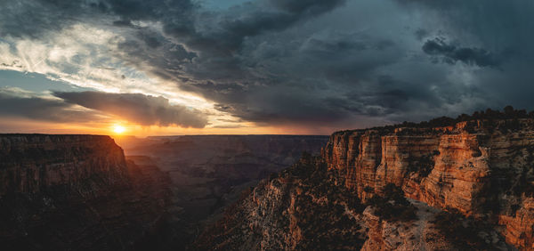 Scenic view of rock formation against sky during sunset