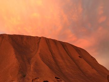 Scenic view of desert against sky during sunset