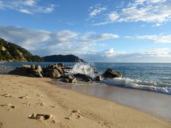 Scenic view of beach against sky