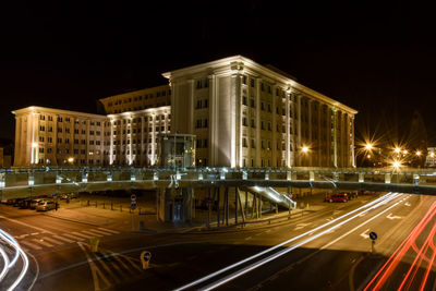 Light trails on road in city at night