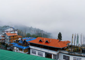 High angle view of buildings in city against sky