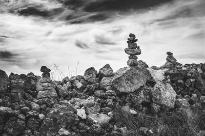 Low angle view of stack of rocks against sky