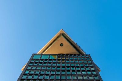 Low angle view of building against clear blue sky