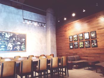 Empty chairs and tables in restaurant