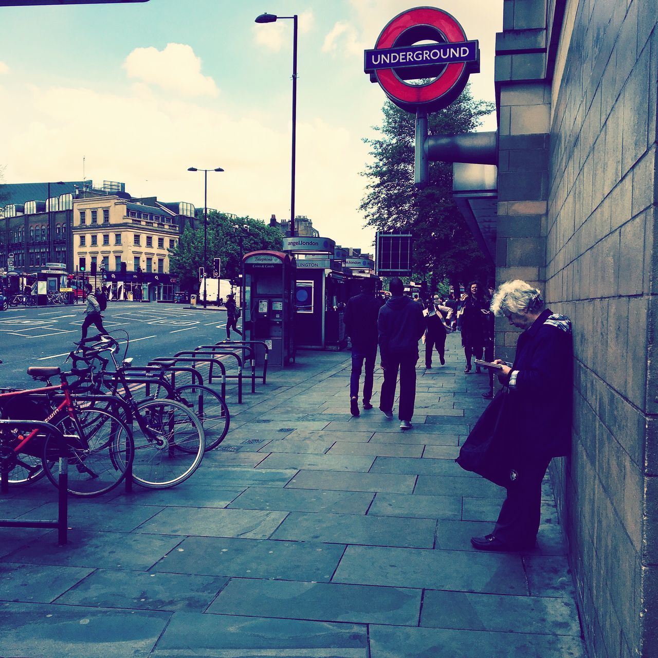 PEOPLE ON ROAD IN CITY