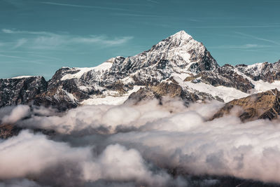 Swiss alps above the clouds .