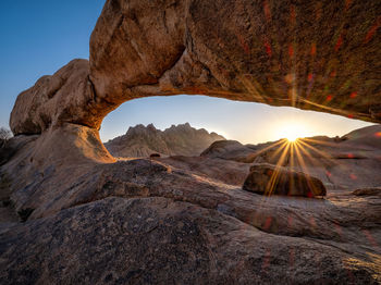 Rock formations on mountain against sky