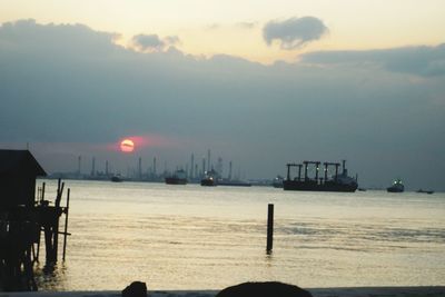 Scenic view of sea against sky at sunset