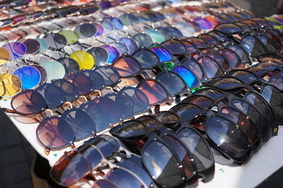 Close-up of multi colored umbrellas for sale at market stall