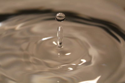 High angle view of drop falling in water