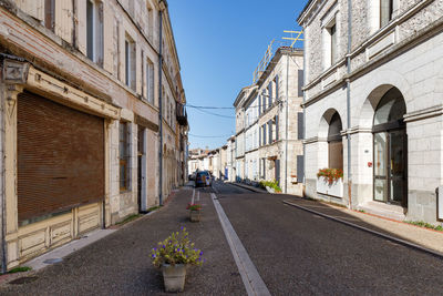 Monflanquin, france - october 17, 2021 architectural detail of typical houses in the city center 