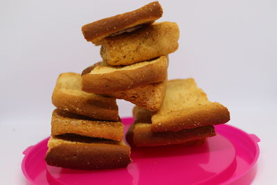 Close-up of cake on plate against white background