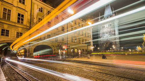 Light trails on road in city at night