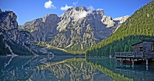 Scenic view of mountains against blue sky