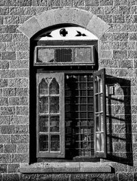 Close-up of window on brick wall