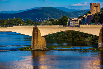 Scenic view of bridge over mountains against sky