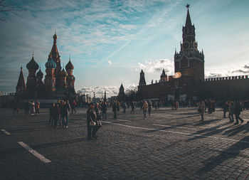 Group of people in front of buildings in city