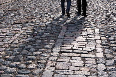 Low section of person standing on street