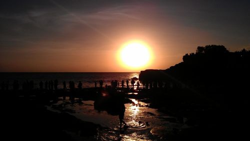 Scenic view of sea against sky at sunset