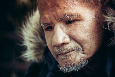 Close-up of man looking down